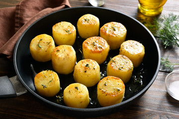 Fondant potatoes in frying pan