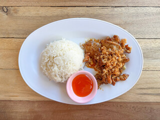 Fried garlic pork with Rice on white plate
