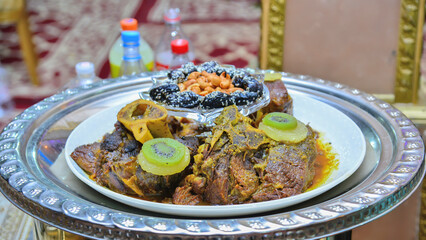 Meat dish with plum, dried pineapple and almonds. One of the most famous Moroccan dishes