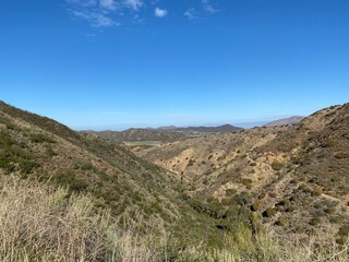 View across the Santa Monica Mountains, Point Mugu State Park, California, with tiny clouds in otherwise clear sky