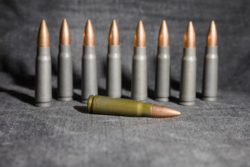 7,62x39 cartridges, gray denim background