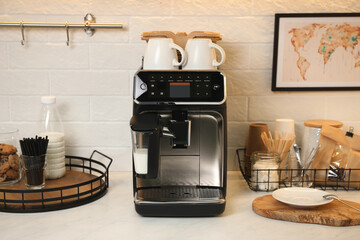 Modern coffee machine on countertop in office kitchen