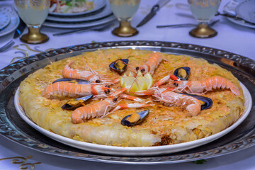 Traditional whole fresh baked Moroccan fish pastilla close up