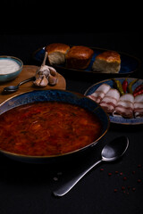 plate with Ukrainian red borscht lard and garlic