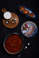 plate with Ukrainian red borscht lard and garlic
