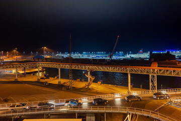 Ferry terminal and linkspan to the ro-ro ship in the harbor of Ystad at night. The ferry connects the city of Świnoujście in Poland and Ystad in Sweden