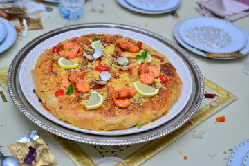 Fresh baked Moroccan fish pastilla close up.