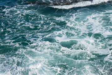 blue mediterranean sea with waves and foam natural water background