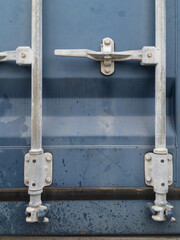 Close-up of a double door lock of a blue shipping container - 481865856