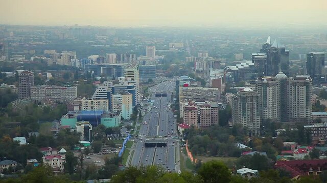 Beautiful evening view of Almaty city from the lookout at Kok Tobe mountain Kazakhstan Central Asia. View of Al-Farabi Avenue.