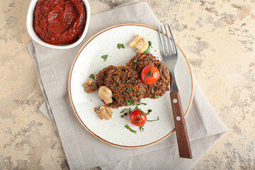 Plate with tasty lentil cutlets on grunge background