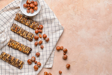 Tasty chocolate nut bars on grunge background