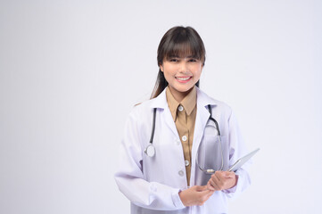 Young female doctor with stethoscope over white background