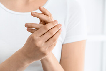 Hands of beautiful young woman at home, closeup