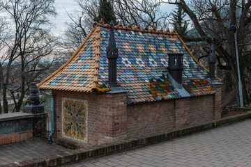 Fototapeta premium Building with colorful roof tiles in Zsolnay Cultural Quarter in Pecs, Hungary