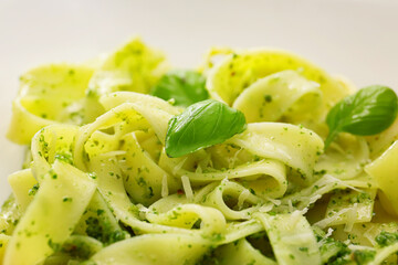 Plate of tasty pesto pasta, closeup