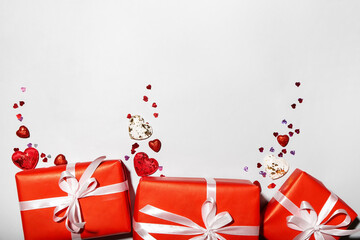 Valentine's Day gifts and hears on light background