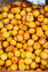 fresh ripe yellow peaches in a box
