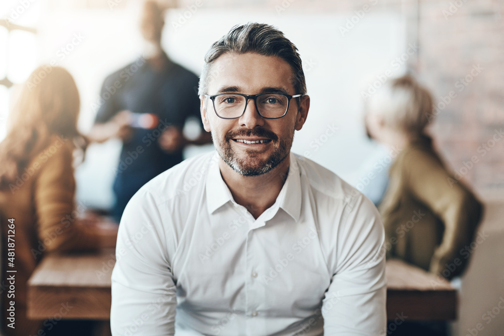 Poster make each day a success. cropped portrait of a businessman sitting in the boardroom during a present