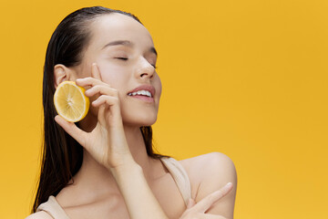 beautiful woman with lemon near face clean skin care health close-up Lifestyle