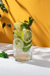 Lemonade with lemon, mint and ice in a beautiful glass