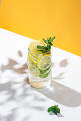 Lemonade with lemon, mint and ice in a beautiful glass