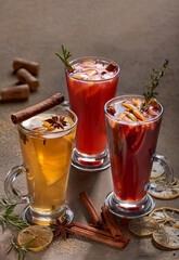 Mulled wine in assortment on a brown background