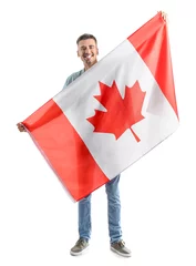 Fotobehang Young man with Canadian flag isolated on white © Pixel-Shot