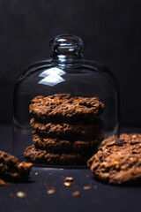 Chocolate chip cookies with chocolate chips on a black background. Sweet chocolate treat. homemade cookies