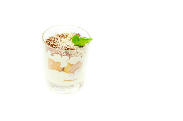 Italian dessert tiramisu in a glass isolated on white background.