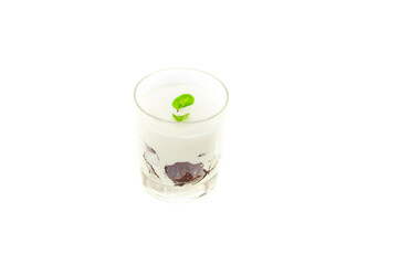 Yogurt dessert in a glass isolated on white background.