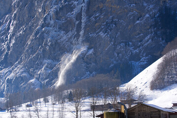 Avalanche at mountain village Lauterbrunnen at Bernese Highlands at the Swiss Alps on a sunny winter day. Photo taken January 15th, 2022, Lauterbrunnen, Switzerland.