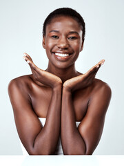 Flawless skin deserves to be flaunted. Studio portrait of a beautiful young woman posing against a...