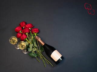 Valentine's day concept. Bottle of champagne, glasses of champagne and red roses.