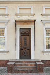 Closed door of beautiful old building on city street