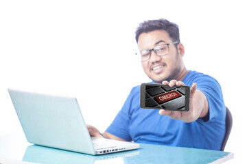 blurred corporate man showing omicron keyword on cell phone screen with funny expression