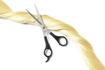 Blonde hair strand for donation with scissors on white background