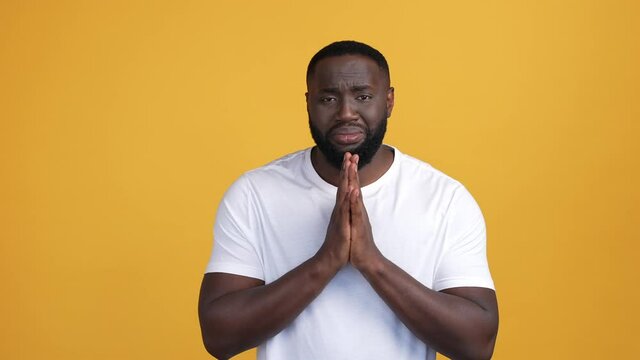 Disappointed guy struggle ask help faith isolated vibrant color background