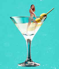 Young slim girl into martini cocktail glass isolated on blue background. Contemporary art collage,...