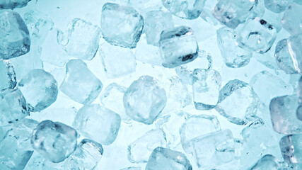 Crystal clear ice cubes background, top view