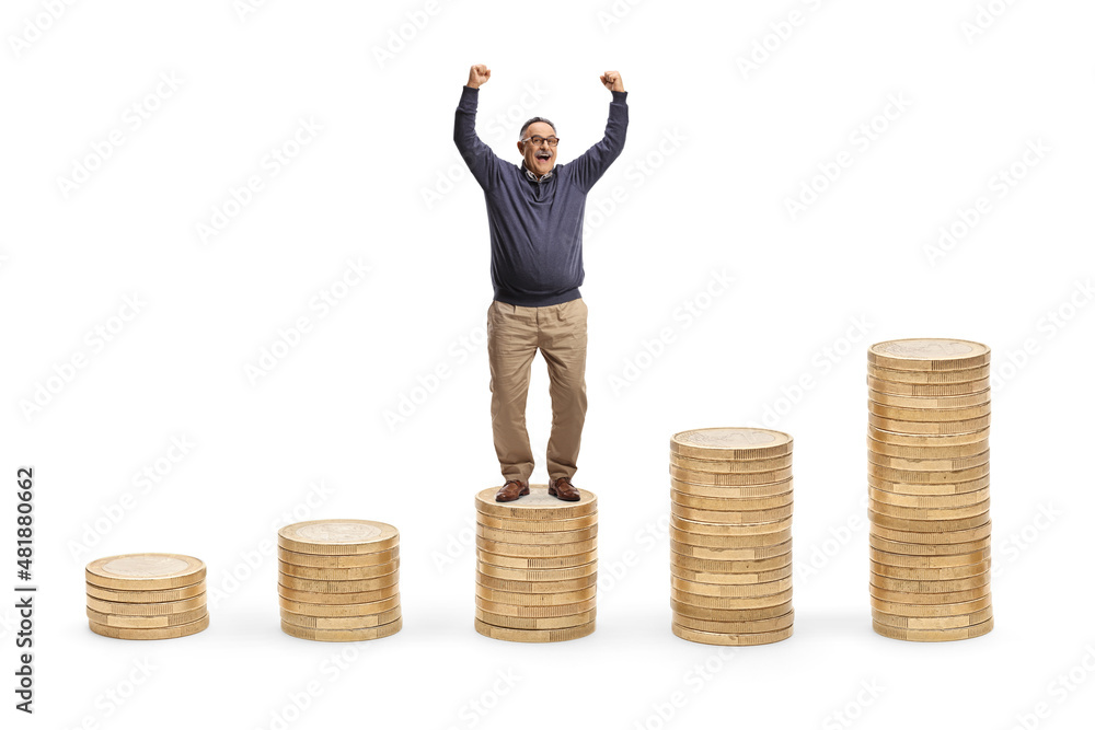 Poster Full length portrait of a happy mature man gesturing happiness and standing on a pile of coins