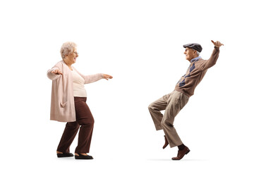 Full length profile shot of an elderly couple dancing