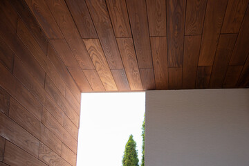 Exterior architecture fragment of thermal wood ceiling and wall cladding