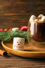 Fototapeta na wymiar Glass of natural hot chocolate with marshmallows on wooden background, closeup