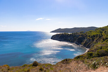 Fototapeta na wymiar View over the sea and coast of Elba island in Italy with blue sky in summer
