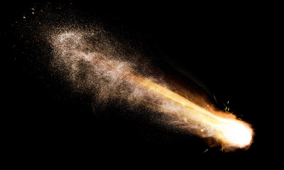 texture of a falling comet with sparks, smoke and a trail of particles, isolated on a black background - 481885250