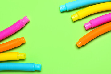 Pop Tubes on green background