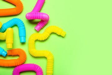 Pop Tubes on green background