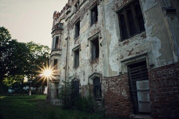 Fototapeta na wymiar Urban exploration. Old building in the countryside. Rays of the sun, former castle. Czech Republic.