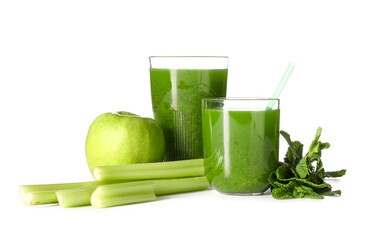Glasses of healthy green juice and fresh ingredients on white background